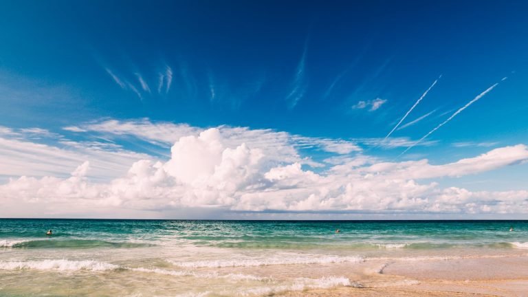 A tranquil seascape of Varadero Beach in Cuba with clear skies and turquoise waters.